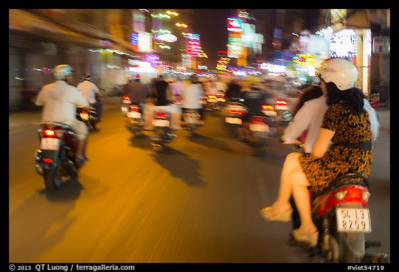 Riders view of motorcycle traffic blurred by speed. Ho Chi Minh City, Vietnam (color)