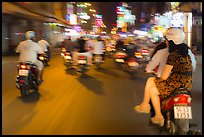 Riders view of motorcycle traffic blurred by speed. Ho Chi Minh City, Vietnam ( color)