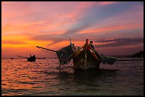 Man on fishing boat at sunset. Mui Ne, Vietnam (color)