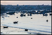 Fishing fleet and village at dawn. Mui Ne, Vietnam (color)