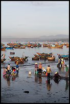 Miror-like beach and fishing boats, early morning. Mui Ne, Vietnam (color)