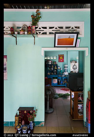 House interior with altars and picture. Mui Ne, Vietnam (color)