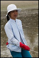 Fisherwoman pulling net line. Mui Ne, Vietnam (color)