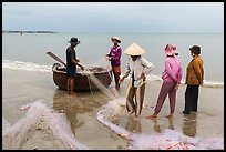 Fishermen, net, and coracle boat. Mui Ne, Vietnam (color)