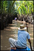 Padding in mangrove-lined narrow waterway, Phoenix Island. My Tho, Vietnam ( color)
