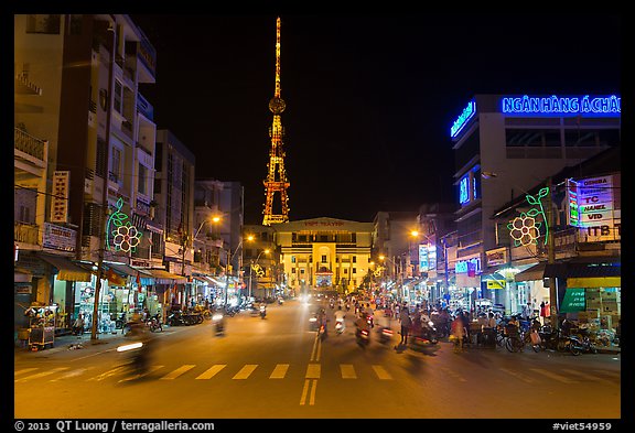 Main street and telecomunication tower at night. Tra Vinh, Vietnam