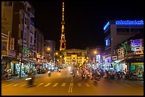Main street and telecomunication tower at night. Tra Vinh, Vietnam ( color)