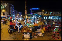Street market and telecomunication tower at night. Tra Vinh, Vietnam (color)