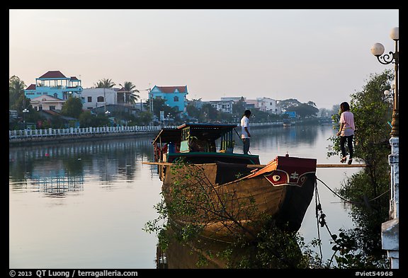 Couple on barge, Long Binh River. Tra Vinh, Vietnam (color)