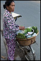 Woman vending food out of bicycle. Tra Vinh, Vietnam (color)