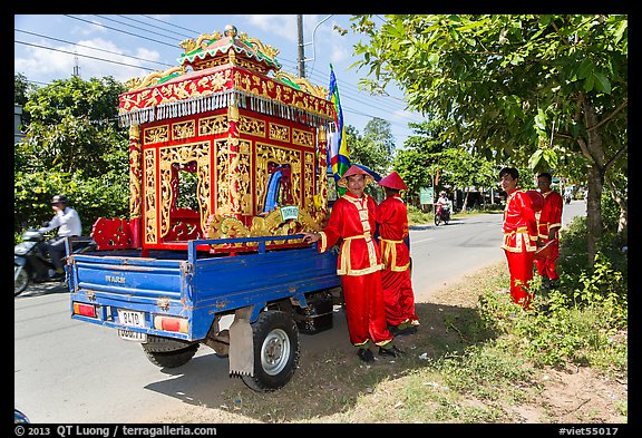 Funeral vehicle and attendants. Tra Vinh, Vietnam