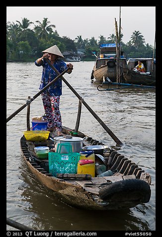 Woman paddles boat with pho noodles, Phung Diem. Can Tho, Vietnam