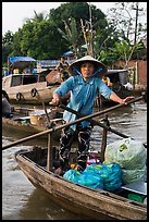 Woman using the x-shape paddles. Can Tho, Vietnam ( color)