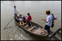 Schoolchildren stepping onto boat. Can Tho, Vietnam (color)