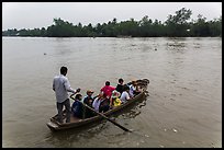 Schoolchildren crossing river on boat. Can Tho, Vietnam (color)