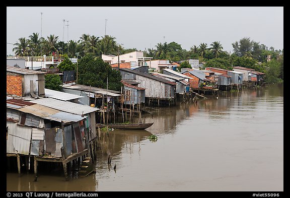 Riverside houses on stilts. Mekong Delta, Vietnam