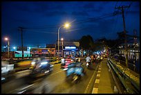 Evening traffic by the canal, District 8. Ho Chi Minh City, Vietnam ( color)