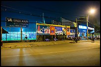 Street and stadium at night, District 8. Ho Chi Minh City, Vietnam ( color)