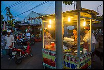 Food vendor at dusk, Con Dao Market, Con Son. Con Dao Islands, Vietnam ( color)