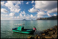 Fisherman climbing on boat, Con Son. Con Dao Islands, Vietnam ( color)