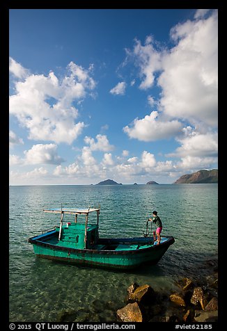 Fisherman lifting anchor from boat, Con Son. Con Dao Islands, Vietnam (color)