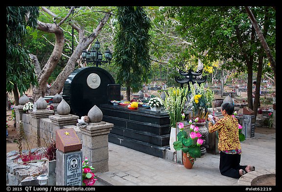 Woman pays respect to Vo Thi Sau grave. Con Dao Islands, Vietnam (color)