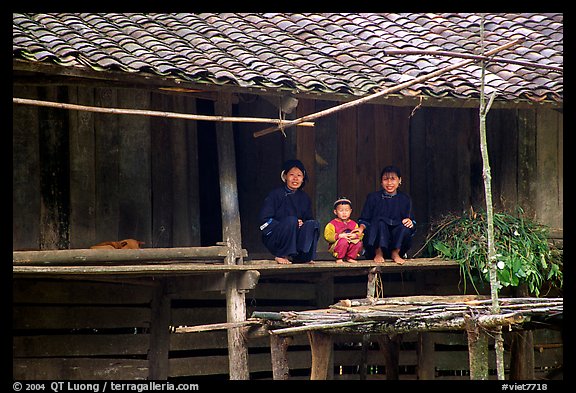 Women and child of the Nung ethnicity in front of their home. Northeast Vietnam