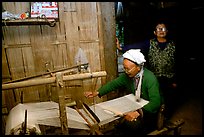 Elderly woman weaving in her home. Northeast Vietnam (color)