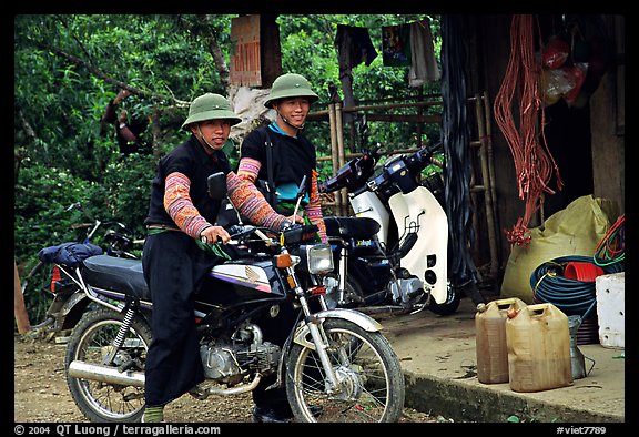 Two Hmong motorcyclists at the Xa Linh market. Northwest Vietnam (color)