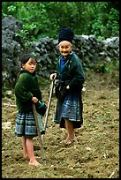 Elderly tribeswoman and girl doing field work  near Yen Chau. Northwest Vietnam ( color)