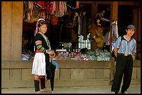 Man and montagnard woman in front of a store, near Lai Chau. Northwest Vietnam (color)