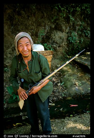 Hunter holding an old rifle, near Lai Chau. Northwest Vietnam (color)