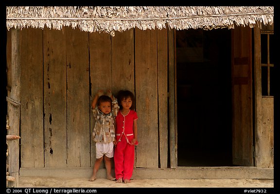 Two kids in front of a hut. Hong Chong Peninsula, Vietnam