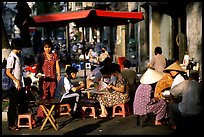 Eating in a street restaurant. Ho Chi Minh City, Vietnam ( color)