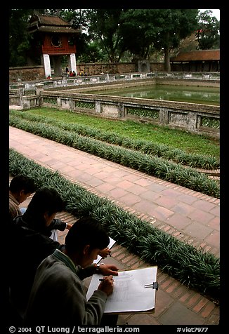 Art students drawing in the Temple of the Litterature. Hanoi, Vietnam (color)