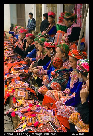Flower hmong women sell colorful clothing at the market. Bac Ha, Vietnam (color)