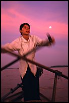 Woman using X-shaped paddles on the Mekong river, Can Tho. Vietnam (color)