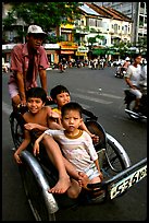 Kids sharing cyclo ride, Ho Chi Minh city. Vietnam ( color)
