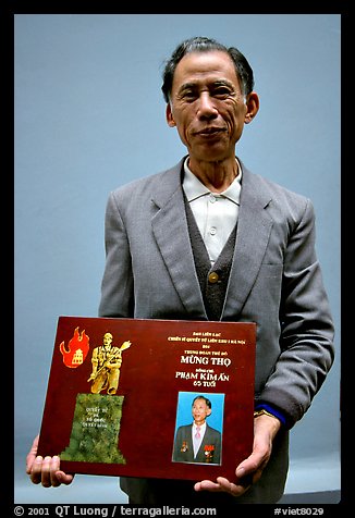 Former militia member with certificate of heroism, Hanoi. Vietnam (color)