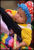 Baby enjoying sugar cane, the natural lollypop,  Bac Ha. Vietnam (color)