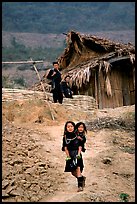 Black Hmong girl and family. Sapa, Vietnam