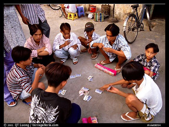 Children playing cards. Ho Chi Minh City, Vietnam