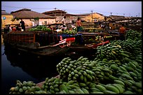 Boats bring loads of produce from the Delta on the Saigon arroyo. Cholon, Ho Chi Minh City, Vietnam ( color)