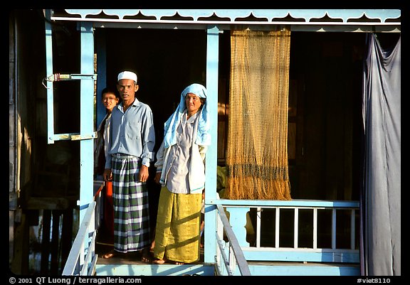Muslem family outside stilt house in Cham minority village. Chau Doc, Vietnam (color)
