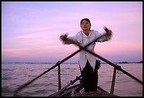 Woman using the X-shaped  paddle characteristic of the Delta. Can Tho, Vietnam ( color)