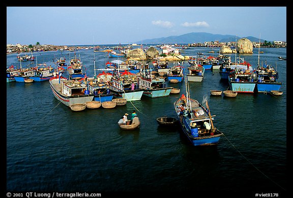 Colorfull fishing boats. Note the circular basket boats used to get to shore.  Nha Trang. Vietnam