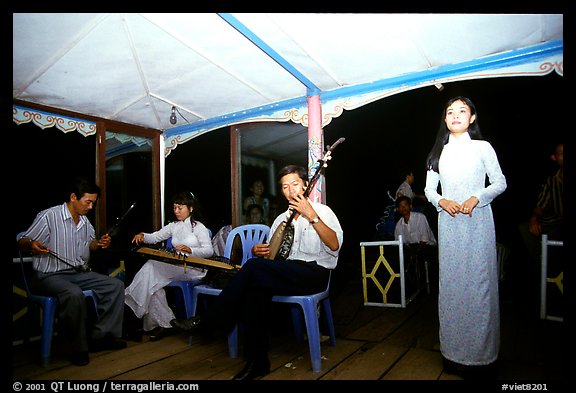 Traditional floating concert on the Perfume river. The city has remained Vietnam's artistic center. Hue, Vietnam (color)