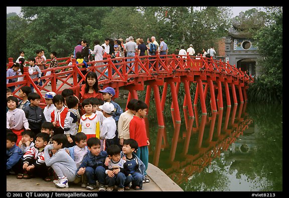 School children at The Huc bridge, Hoan Kiem lake. Hanoi, Vietnam