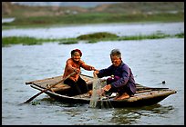 Elderly couple fishing, Ken Ga canal. Ninh Binh,  Vietnam (color)
