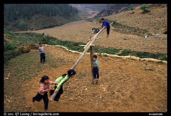 Children playing a rotating swing near Can Cau. Vietnam